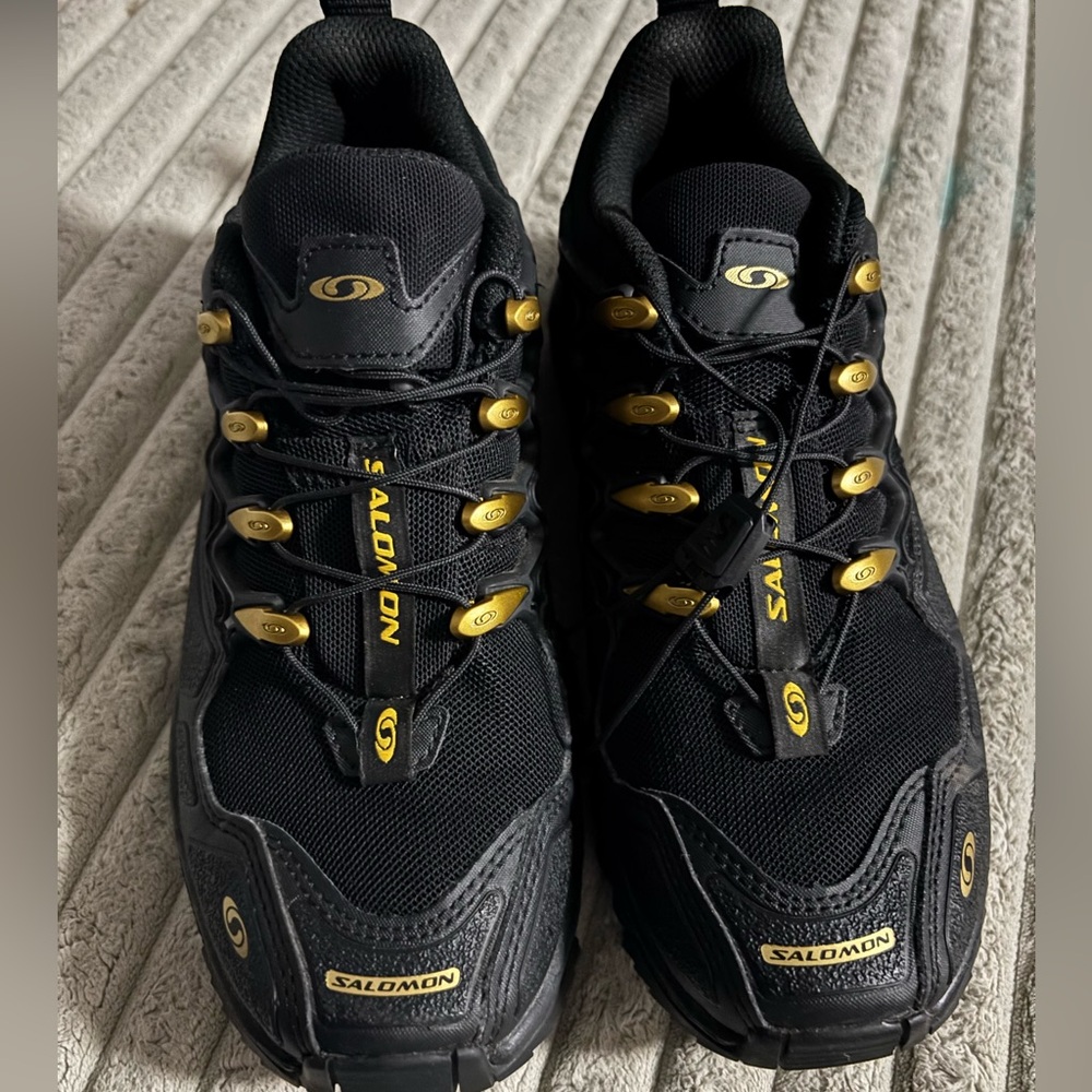 Salomon Black and Gold Shoes